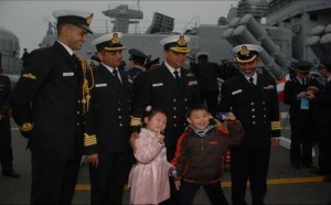 Rear Admiral AG Thapliyal, the Flag Officer Commanding Eastern Fleet with children during a welcome ceremony at Qingdao during the Chinese IFR.