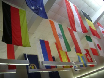 DSC02858 Flags of various countries associated with NASA, hanging from the ceiling of the news center.