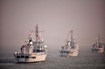 Warships at anchor, waiting to be reviewed by the President. Left: INS Sandhyak, Center: INS Darshak