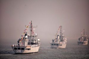 Warships at anchor, waiting to be reviewed by the President. Left: INS Sandhyak, Center: INS Darshak
